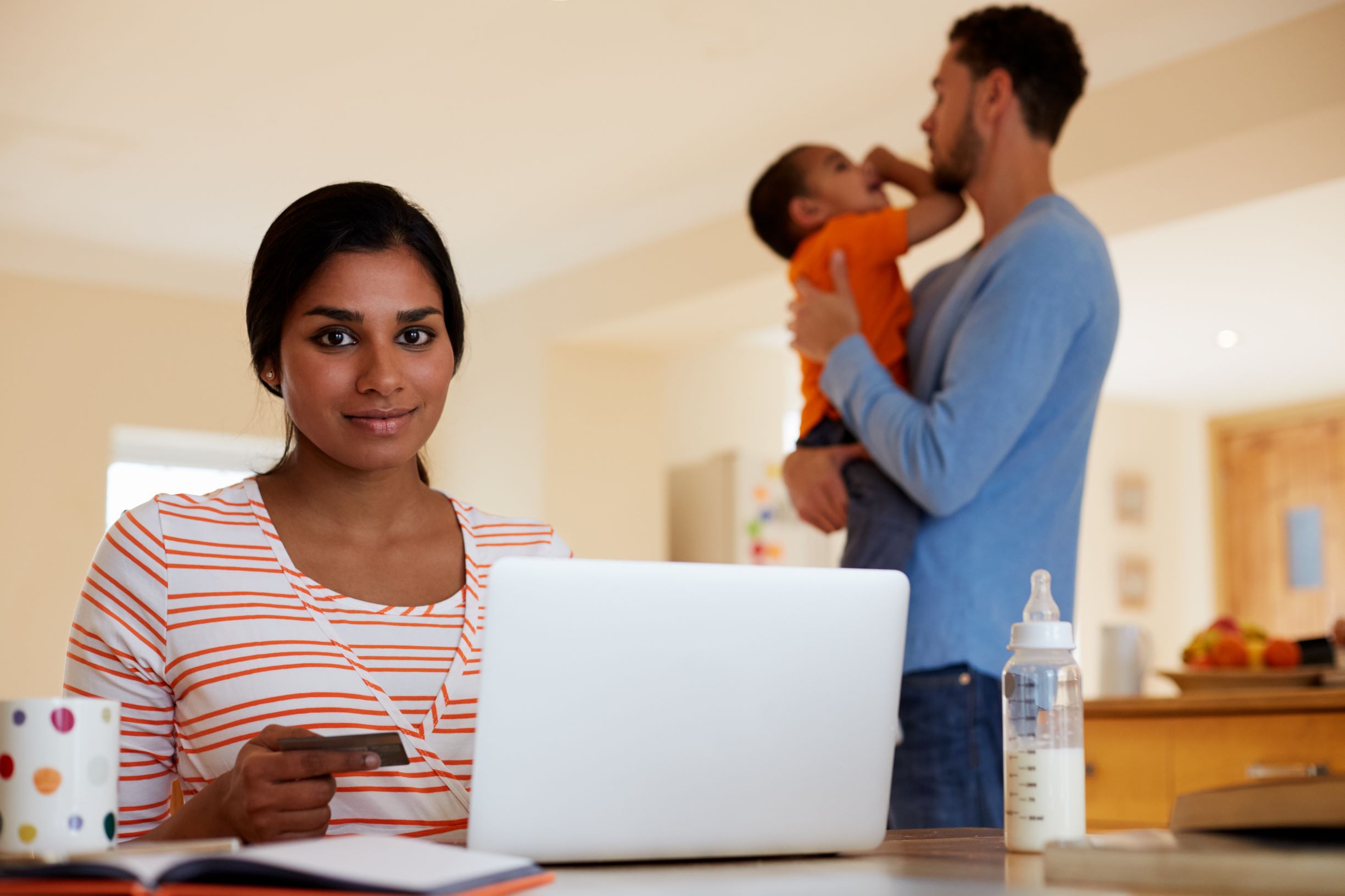 Daily credit score monitoring Family checking daily credit score monitoring on laptop